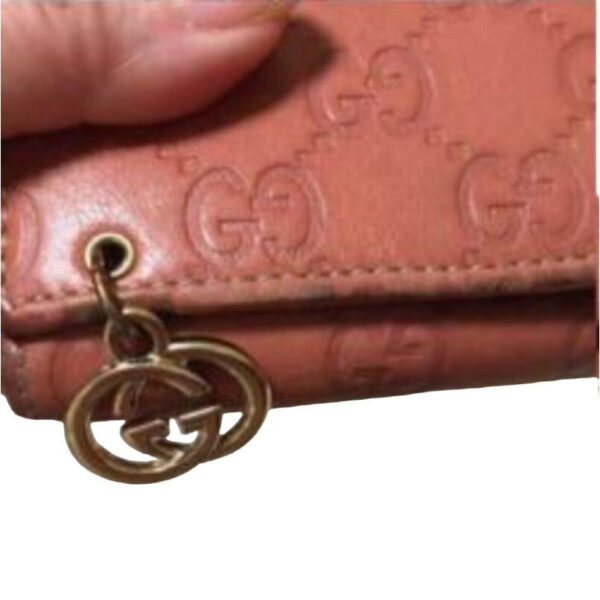 Gucci, salmon colored embossed Guccissima print leather, XL size, wallet on a removable chain | Luna Bags