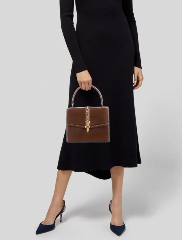 Gucci 1969 Sylvie chestnut brown leather top handle Kelly bag with a gold zipper accent | Luna Bags